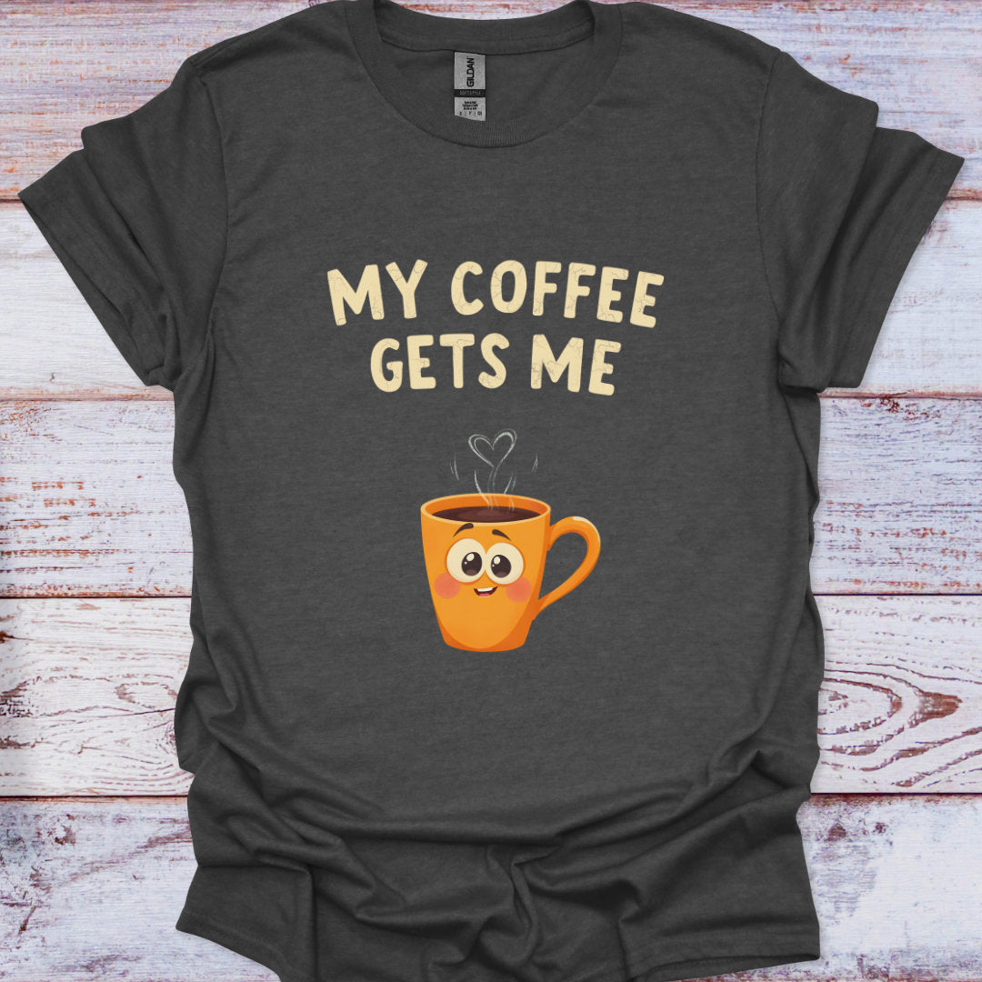Dark gray t-shirt with a cartoon coffee mug and 'My Coffee Gets Me' text on a wooden surface