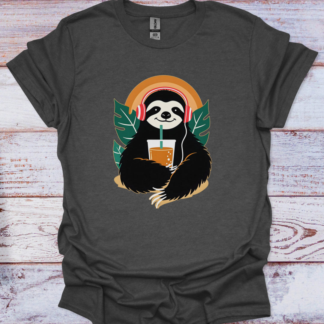 Gray t-shirt with a sloth holding a drink and headphones graphic on a wooden surface