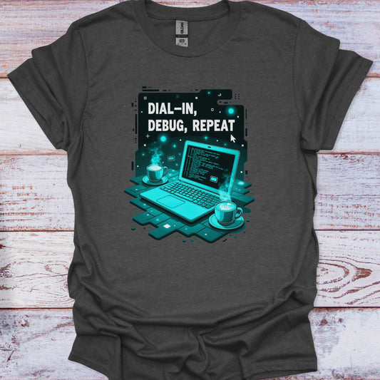 Gray t-shirt with a graphic of a laptop and text 'Dial-In, Debug, Repeat' on a wooden surface.