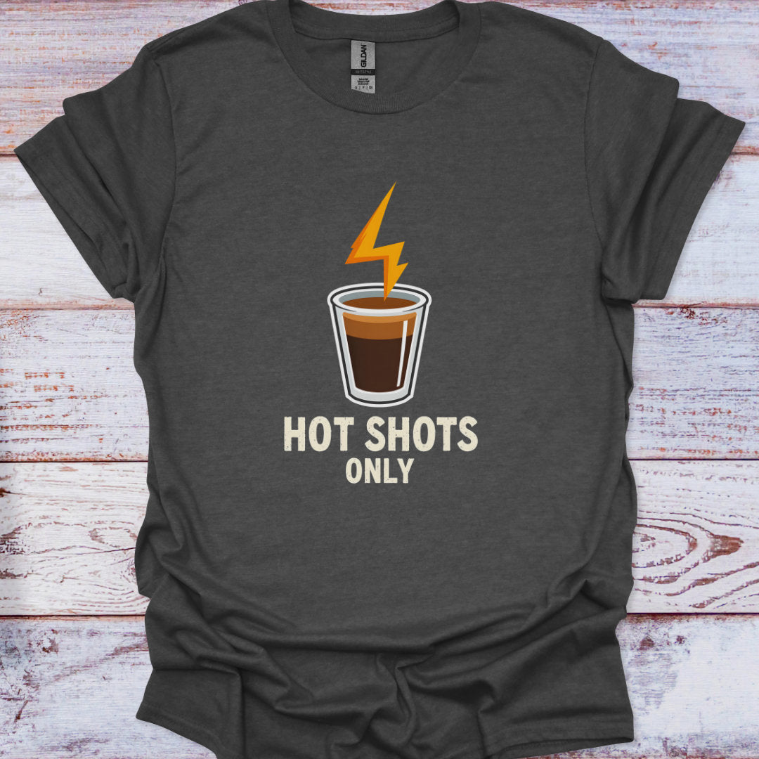 Dark gray t-shirt with a coffee cup graphic and 'Hot Shots Only' text on a wooden surface