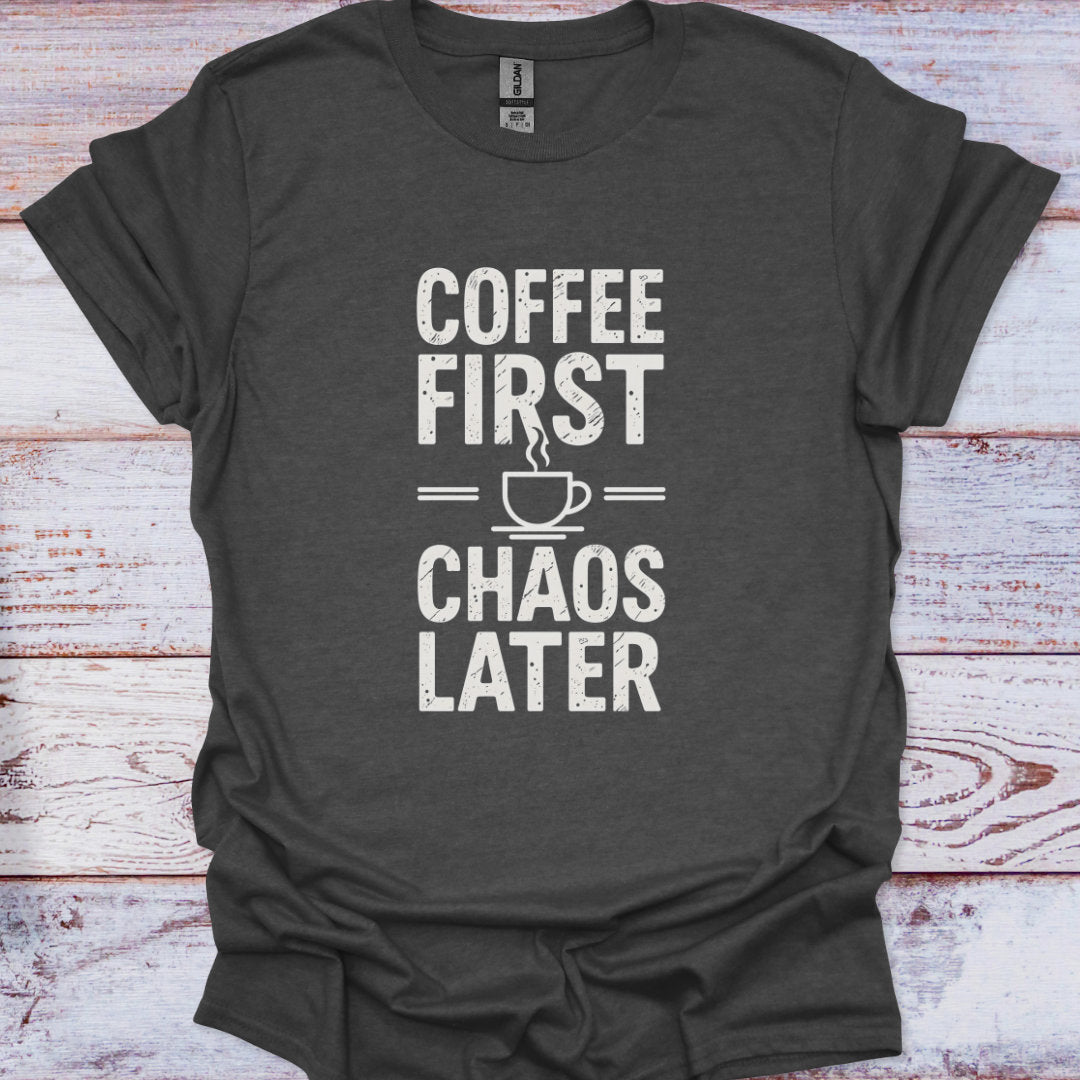 Dark gray t-shirt with 'Coffee First, Chaos Later' text on a wooden surface