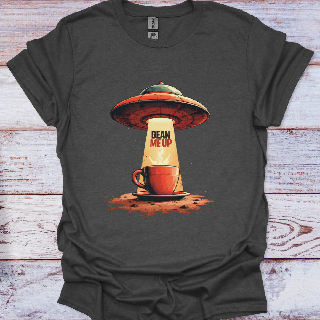 Gray t-shirt with a graphic of a coffee cup and UFO design on a wooden surface