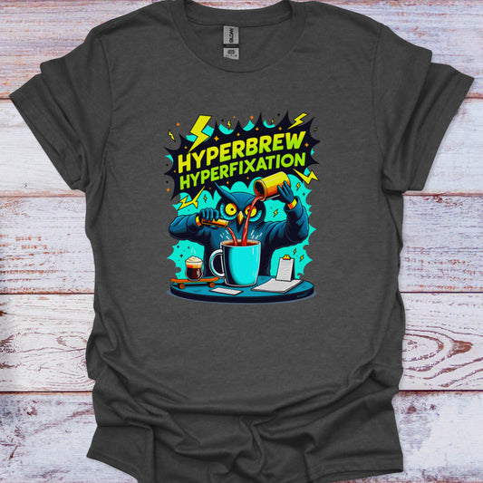 Gray t-shirt with 'Hyperbrew Hyperfixation' graphic design on a wooden surface