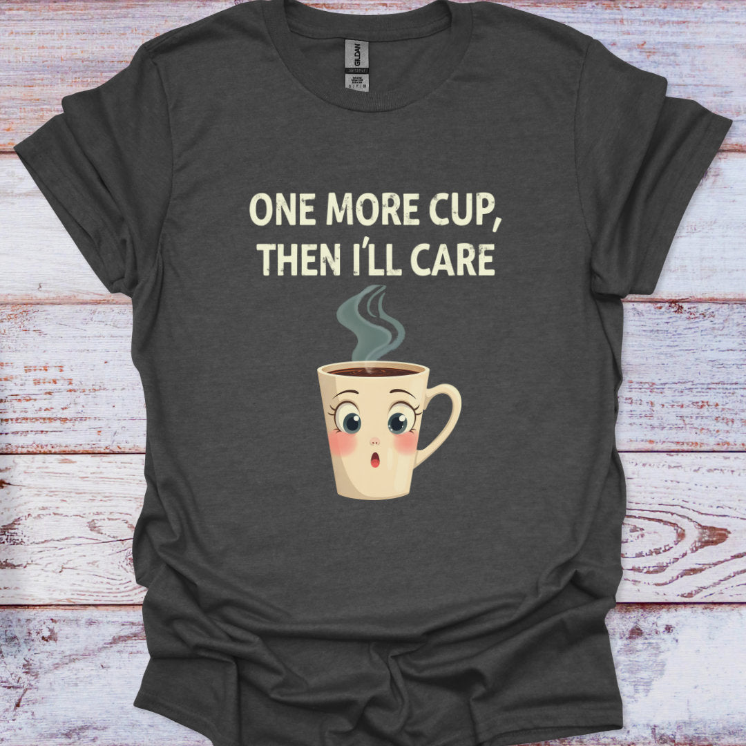 Dark gray t-shirt with a cartoon coffee cup and text on a wooden surface