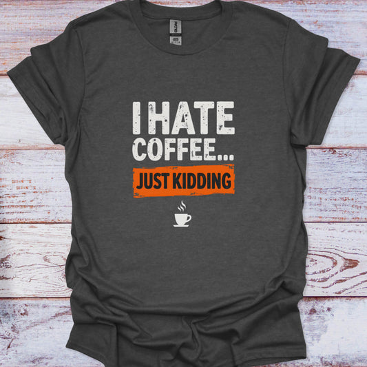 Dark gray t-shirt with humorous text design on a wooden surface