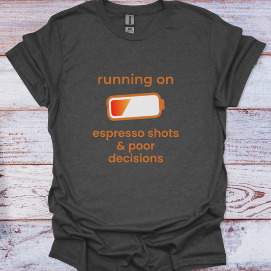 Dark gray t-shirt with orange text and battery graphic on a wooden surface