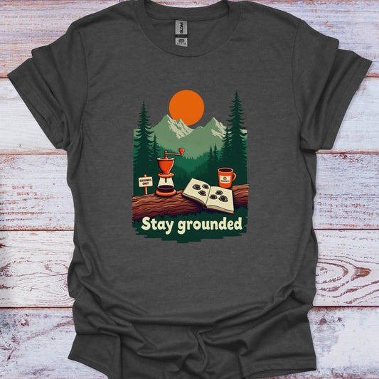 Dark gray t-shirt with a graphic of a coffee grinder, cup, and nature scene on a wooden surface.