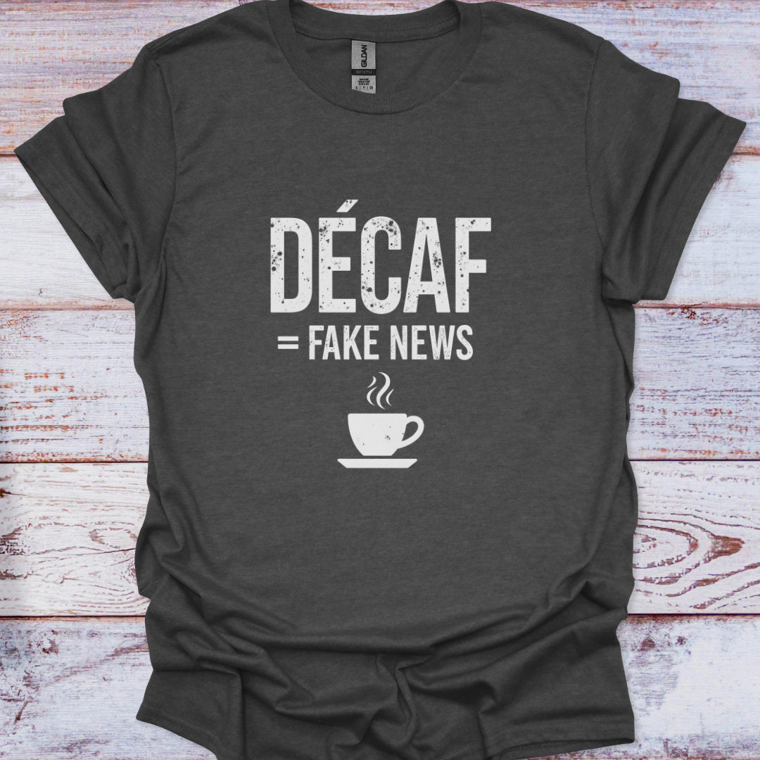 Dark gray t-shirt with 'Décaf = Fake News' text and coffee cup graphic on a wooden surface
