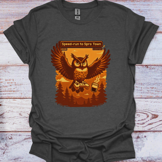 Gray t-shirt with an owl graphic and text on a wooden surface