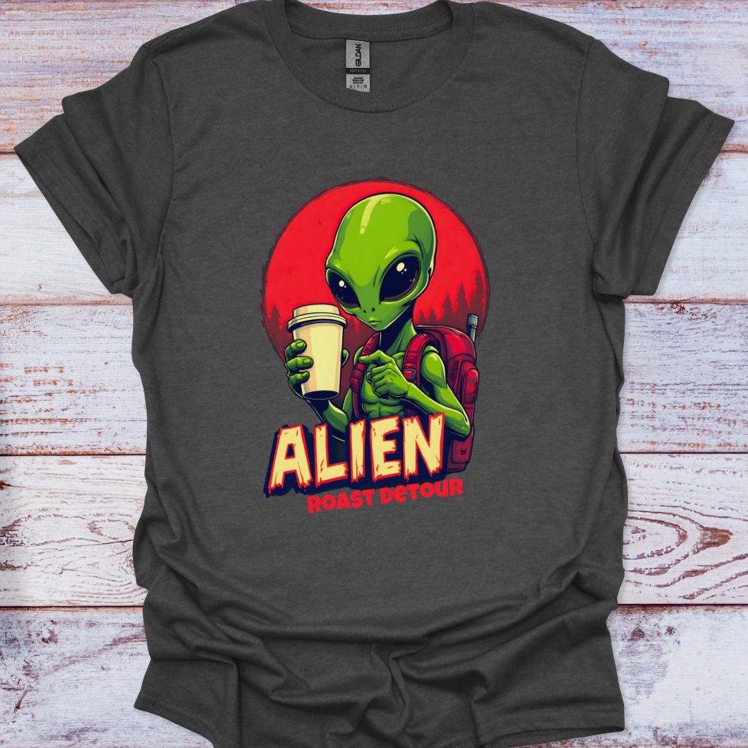 Gray t-shirt with an alien graphic holding a coffee cup on a wooden surface