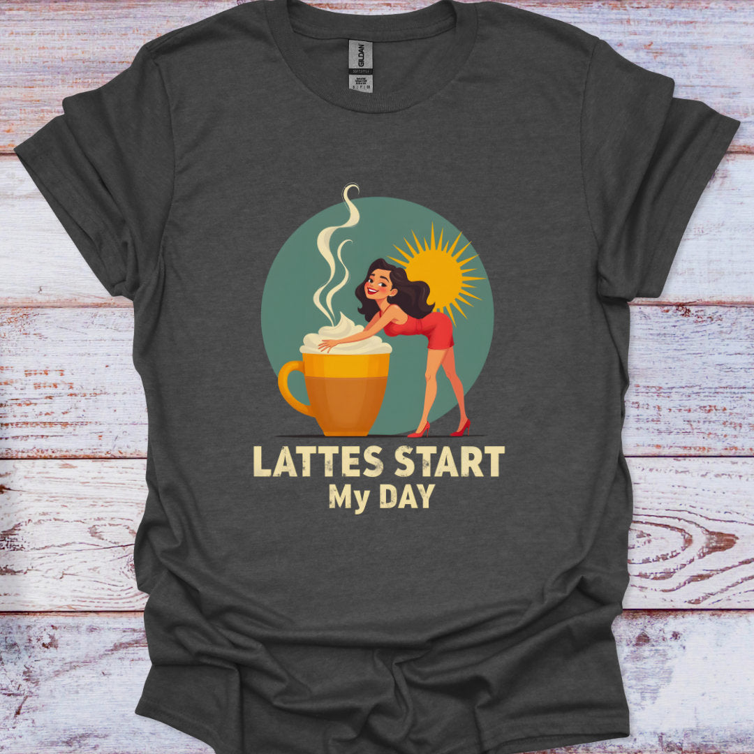 Dark gray t-shirt with a graphic of a woman by a coffee cup and text 'Lattes Start My Day' on a wooden surface.
