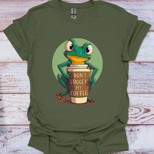Green t-shirt with a frog holding a coffee cup graphic on a wooden surface