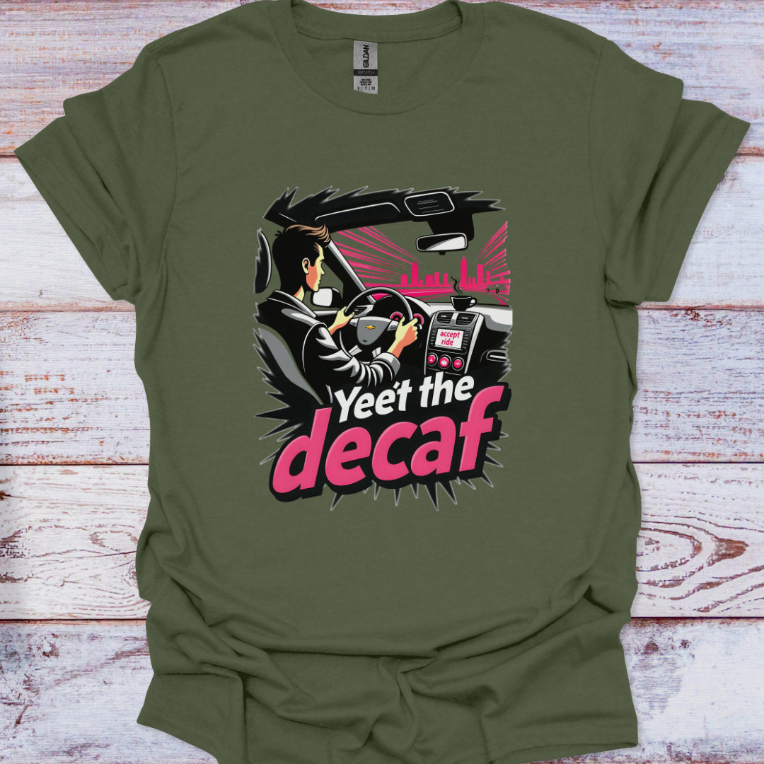 Green t-shirt with a graphic design of a person driving a car and the text 'Yeet the decaf' on a wooden surface.