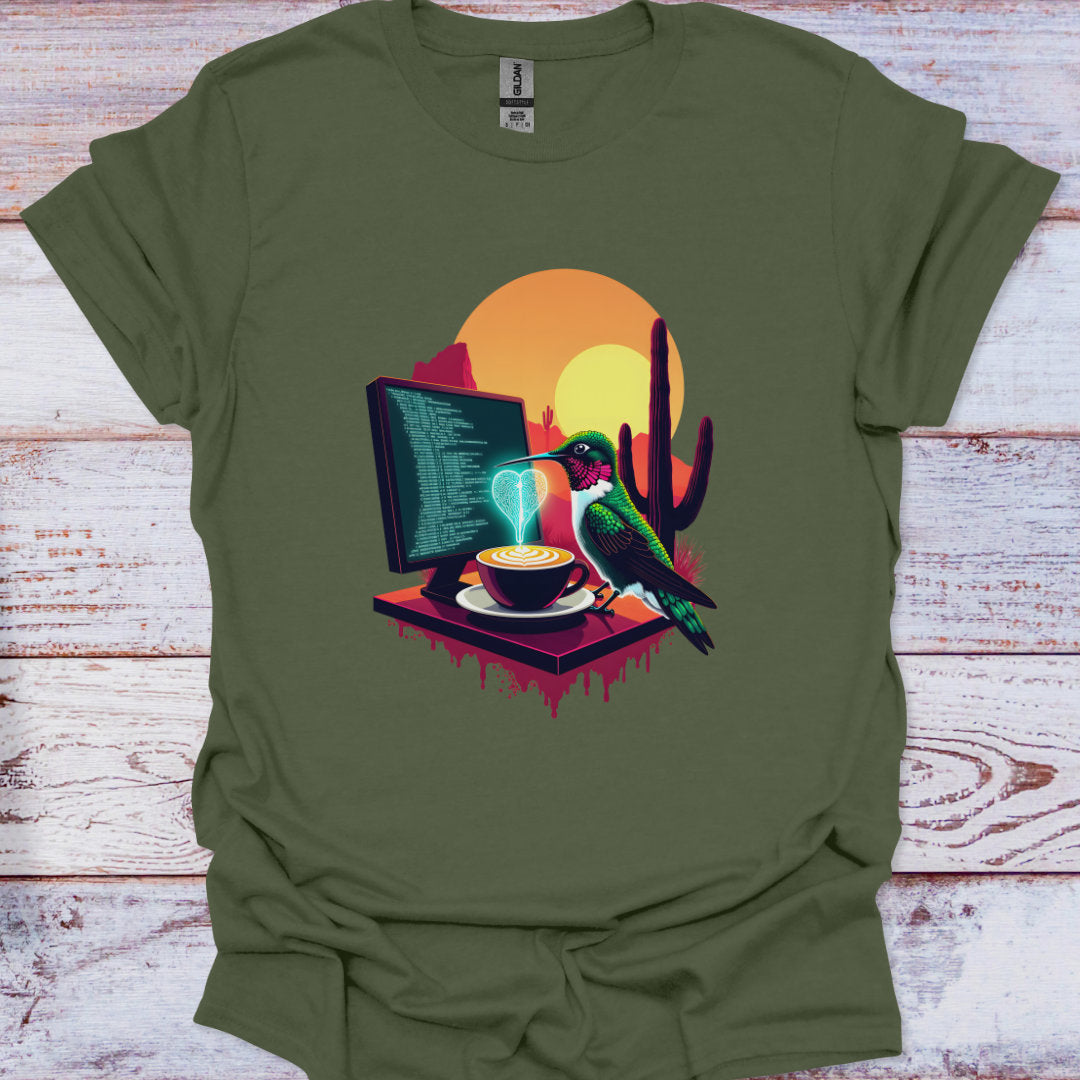 Green t-shirt with a graphic of a bird, computer, and coffee cup on a wooden surface