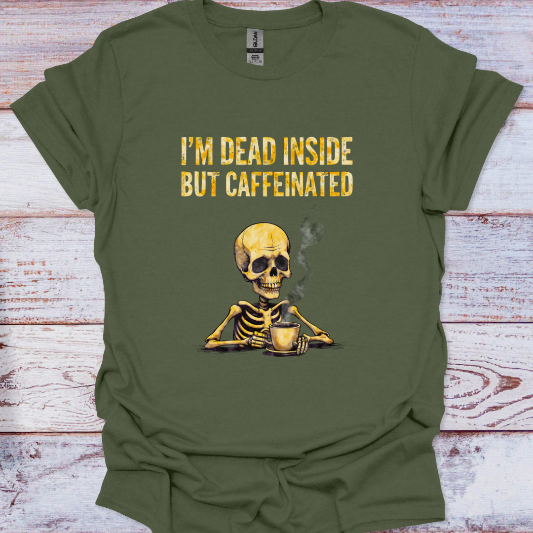 Green t-shirt with a skeleton holding a coffee cup and text 'I'm dead inside but caffeinated' on a wooden surface.