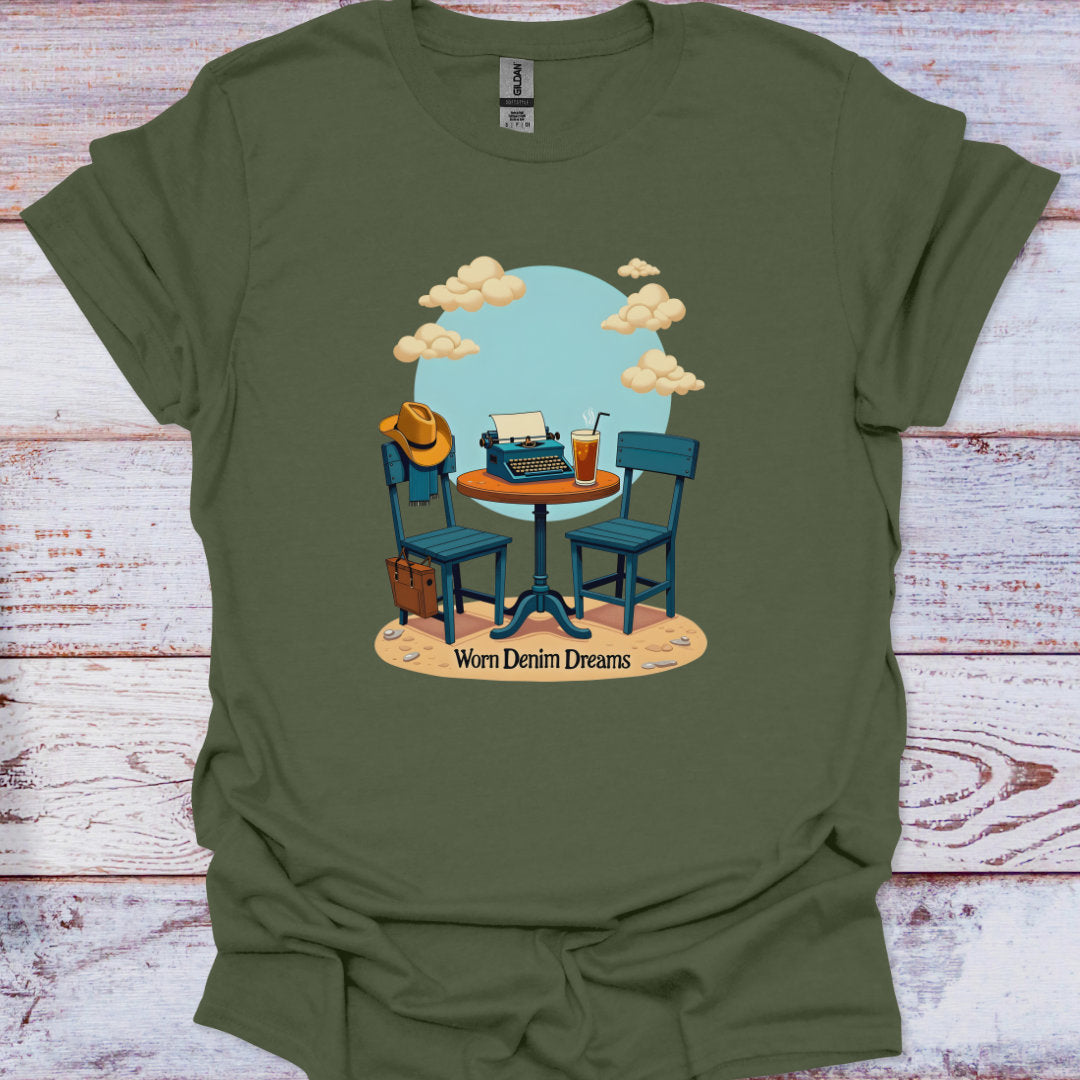 Green t-shirt with a graphic of two chairs, a typewriter, and a cowboy hat on a wooden surface.