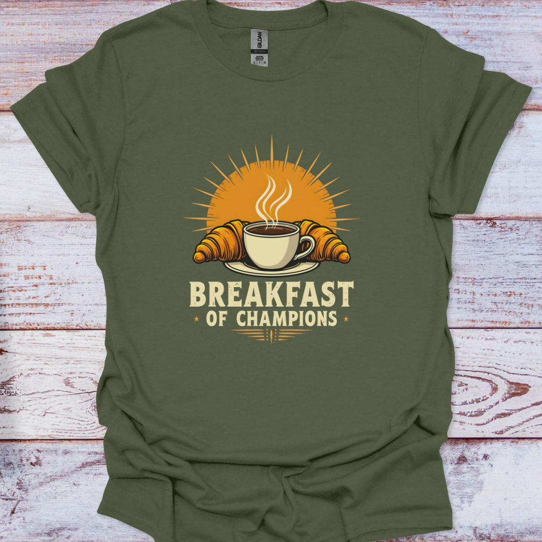 Green t-shirt with 'Breakfast of Champions' graphic on a wooden surface