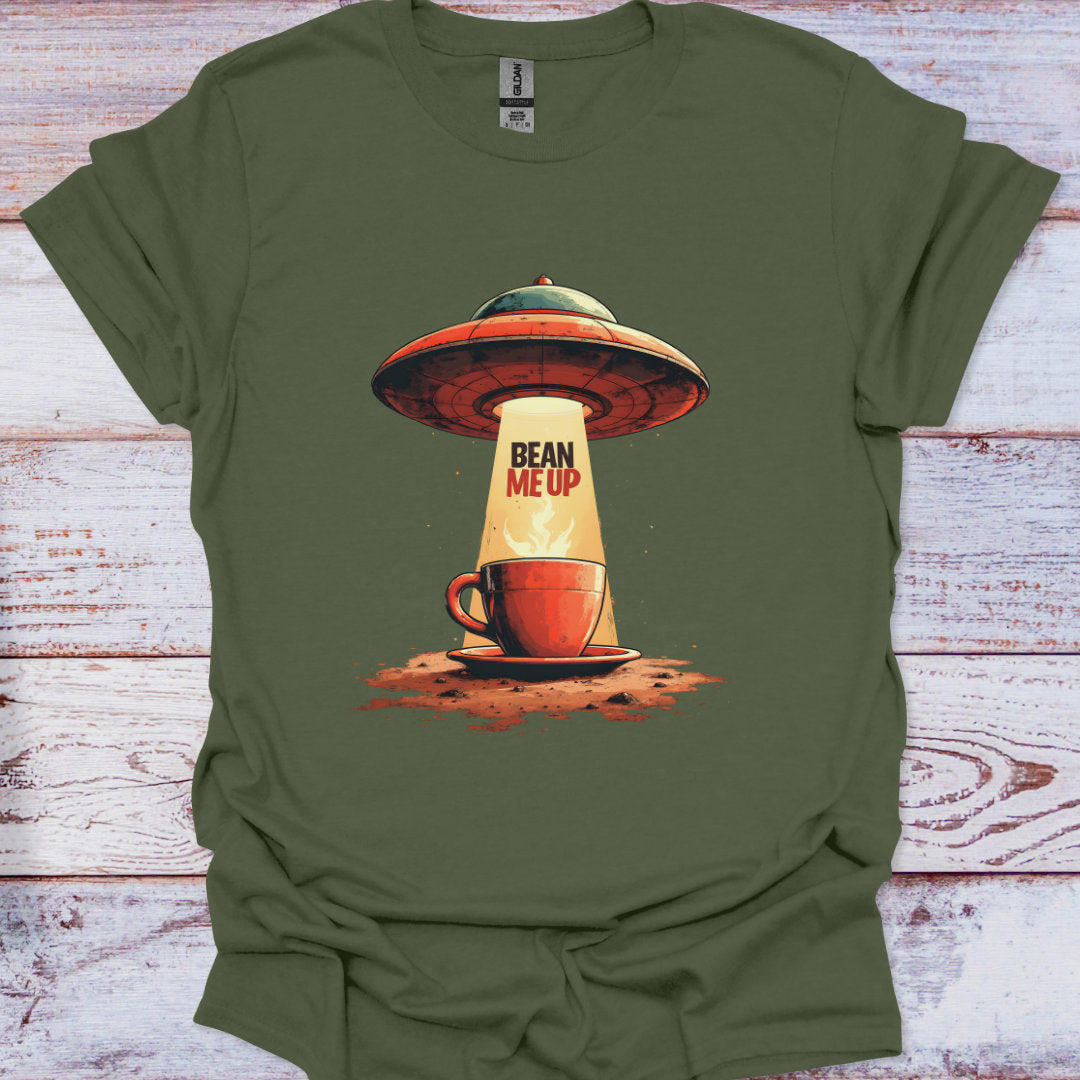Green t-shirt with a coffee cup and UFO design on a wooden surface