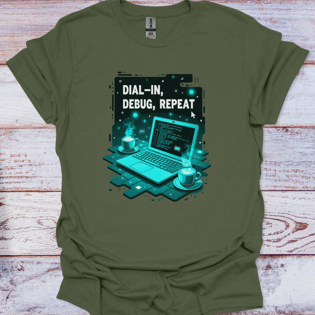 Green t-shirt with a graphic of a laptop and text 'Dial-In, Debug, Repeat' on a wooden surface.