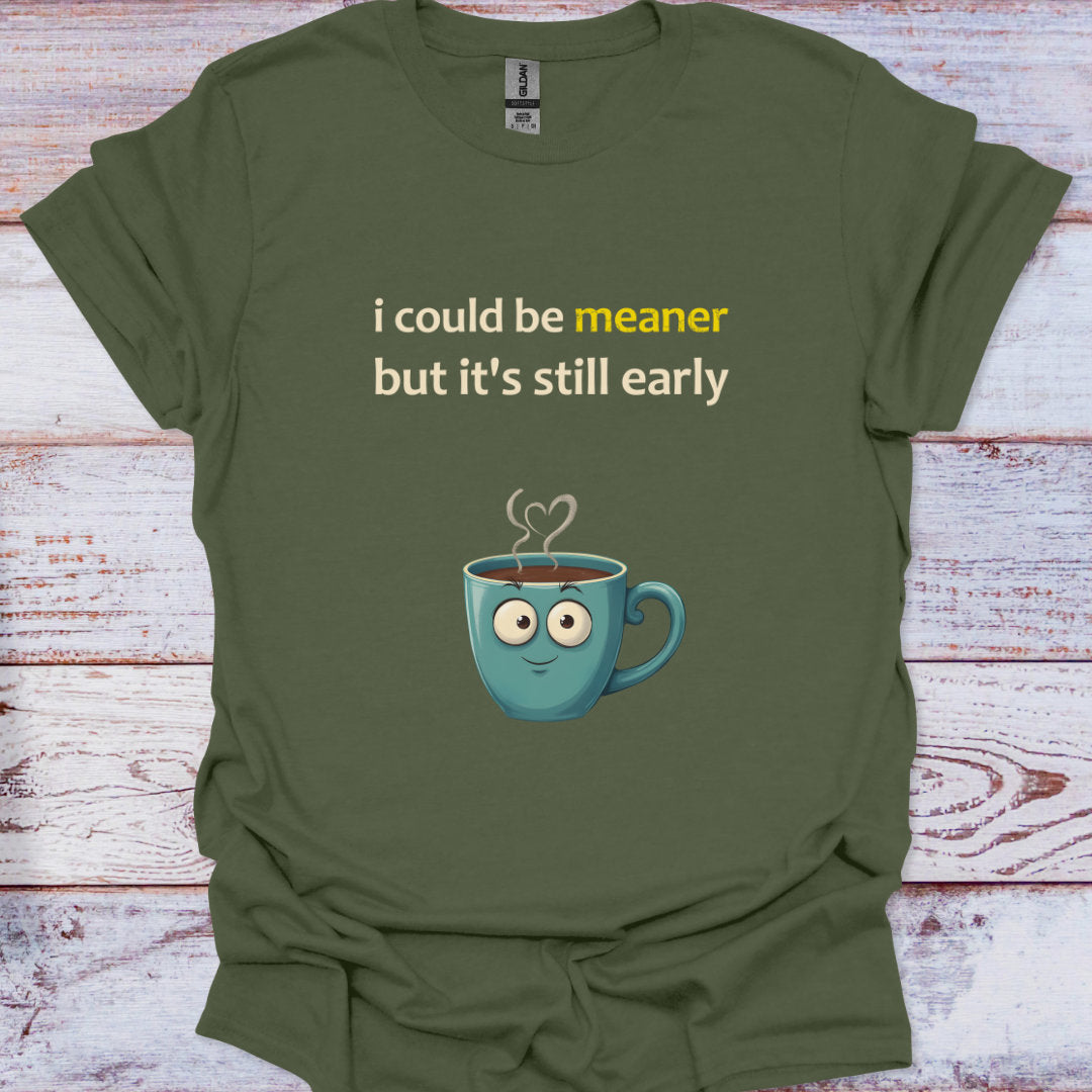 Green t-shirt with a cartoon coffee cup and text on a wooden surface