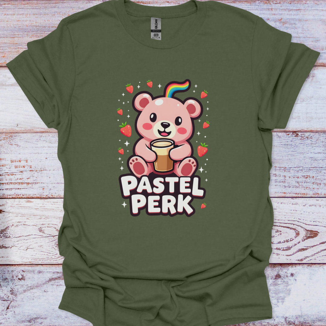 Green t-shirt with a cartoon bear and 'Pastel Perk' text on a wooden surface