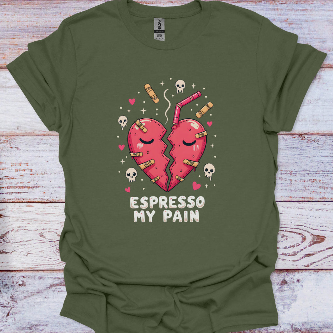 Green t-shirt with a graphic of a broken heart and 'Espresso My Pain' text on a wooden surface.