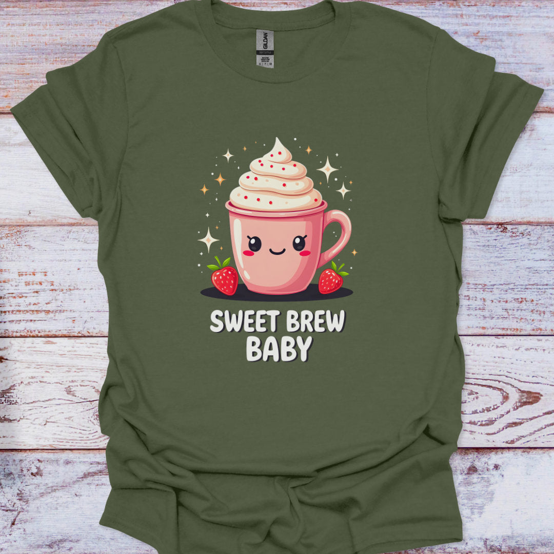 Green t-shirt with a cartoon coffee cup and 'Sweet Brew Baby' text on a wooden surface