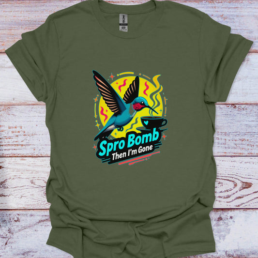 Green t-shirt with a colorful graphic of a hummingbird and text on a wooden surface