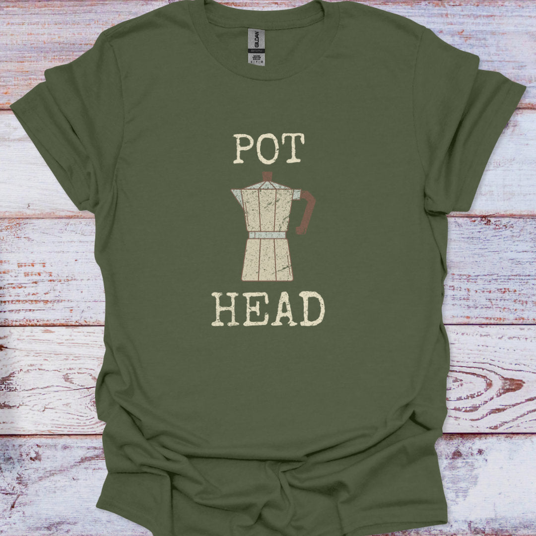 Green t-shirt with 'POT HEAD' graphic and coffee pot design on a wooden surface
