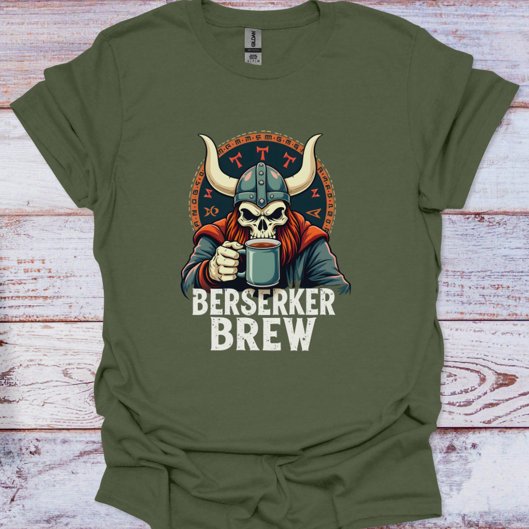 Green t-shirt with a graphic of a skull in a viking helmet holding a mug, labeled 'Berserker Brew', on a wooden surface.