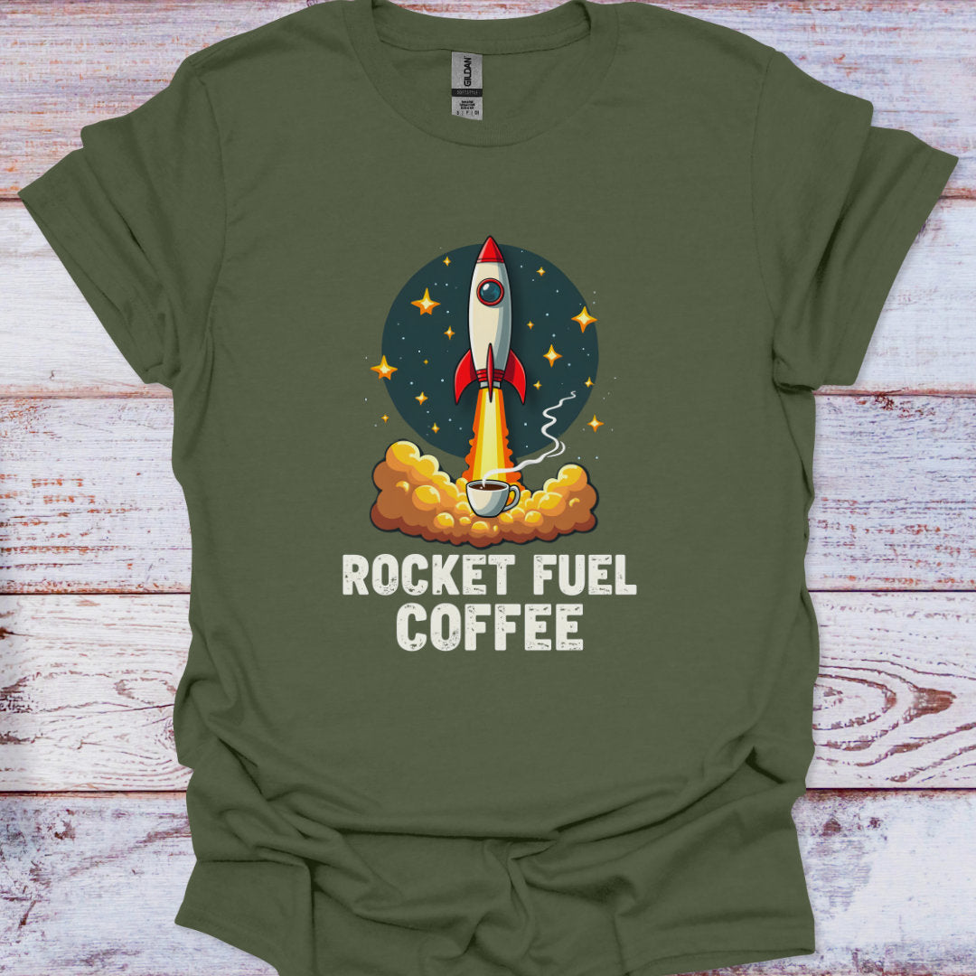 Green t-shirt with a graphic of a rocket and coffee cup labeled 'Rocket Fuel Coffee' on a wooden surface.