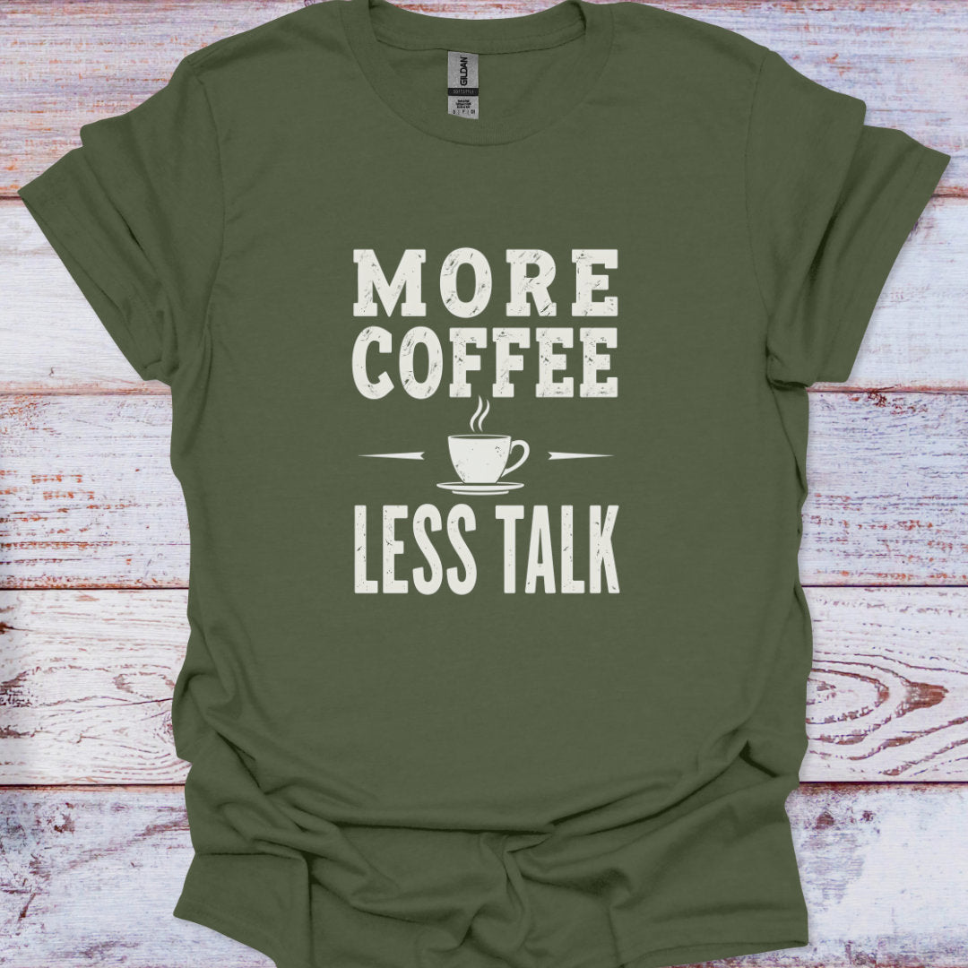 Green t-shirt with 'More Coffee Less Talk' text on a wooden surface