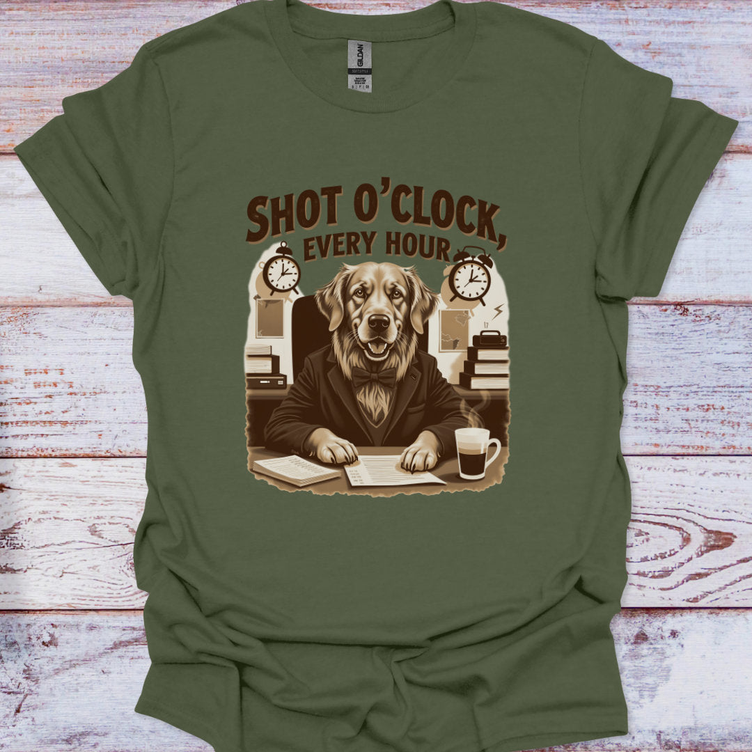 Green t-shirt with a dog graphic and text 'Shot O'Clock Every Hour' on a wooden surface.