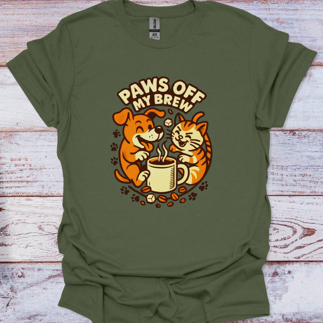 Green t-shirt with a dog and cat graphic and 'Paws Off My Brew' text on a wooden surface.