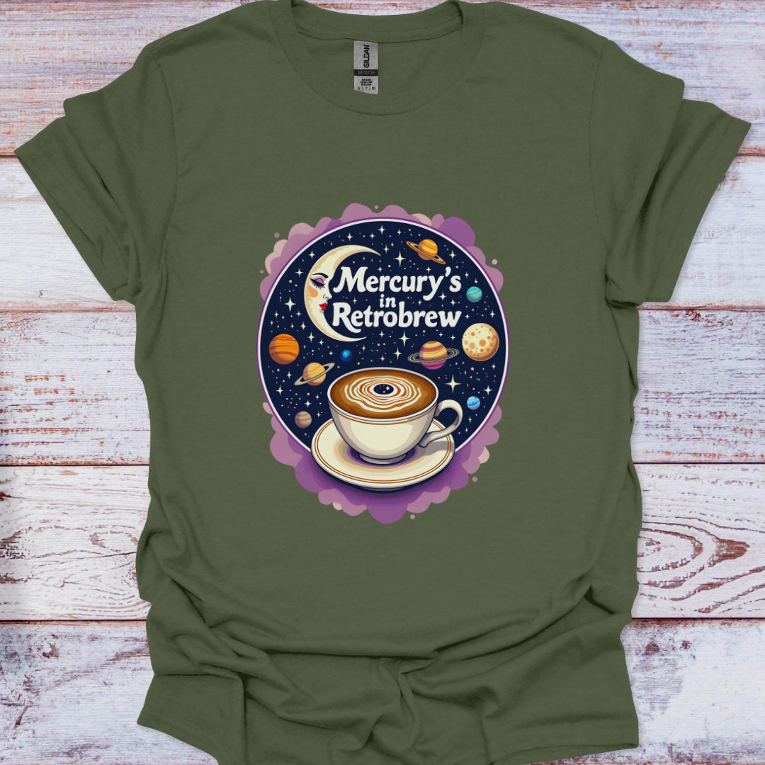 Green t-shirt with a coffee-themed graphic on a wooden surface