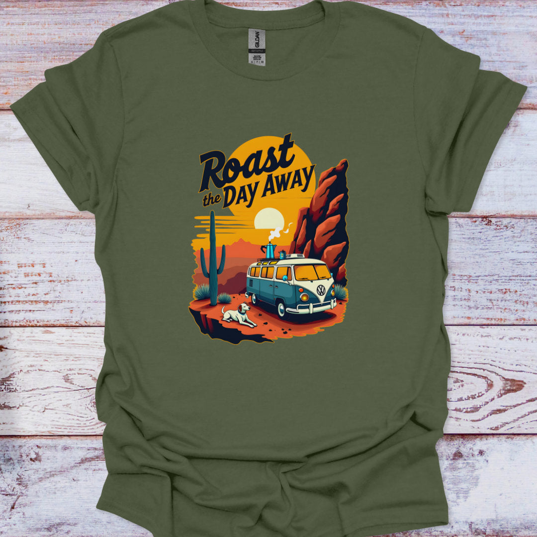 Green t-shirt with a graphic of a van and desert scene on a wooden surface