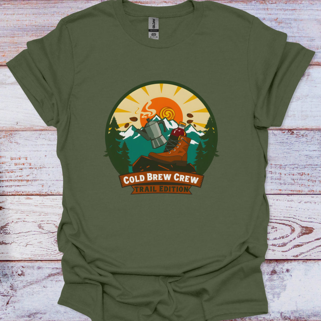 Green t-shirt with 'Cold Brew Crew Trail Edition' graphic on a wooden surface