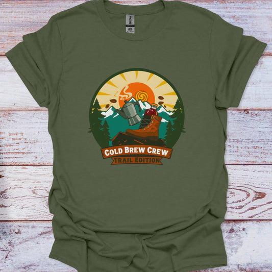 Green t-shirt with 'Cold Brew Crew Trail Edition' graphic on a wooden surface