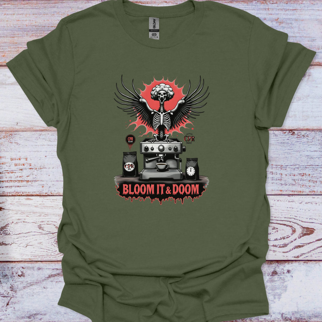 Green t-shirt with a graphic design featuring a skeleton, coffee machine, and 'Bloom It & Doom' text on a wooden surface.