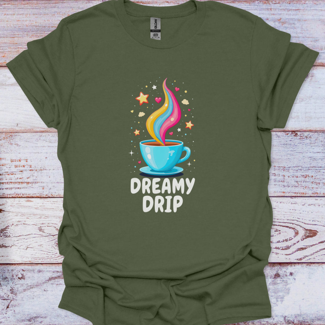 Green t-shirt with a colorful coffee cup graphic and 'Dreamy Drip' text on a wooden surface.