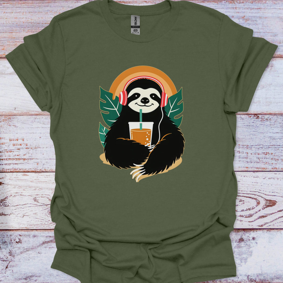 Green t-shirt with a sloth holding a drink and headphones design on a wooden surface