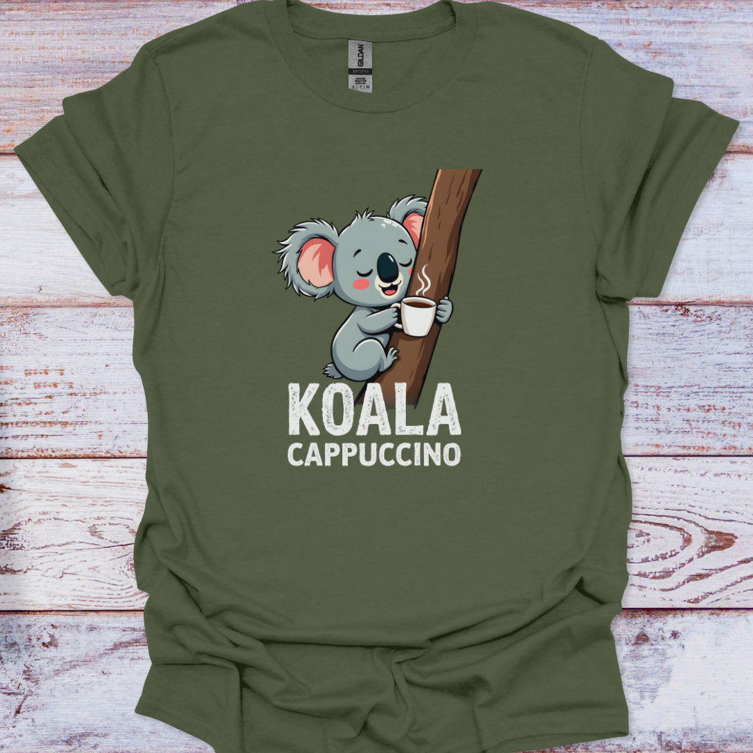 Green t-shirt with a koala holding a coffee cup graphic and 'KOALA CAPPUCCINO' text on a wooden surface.