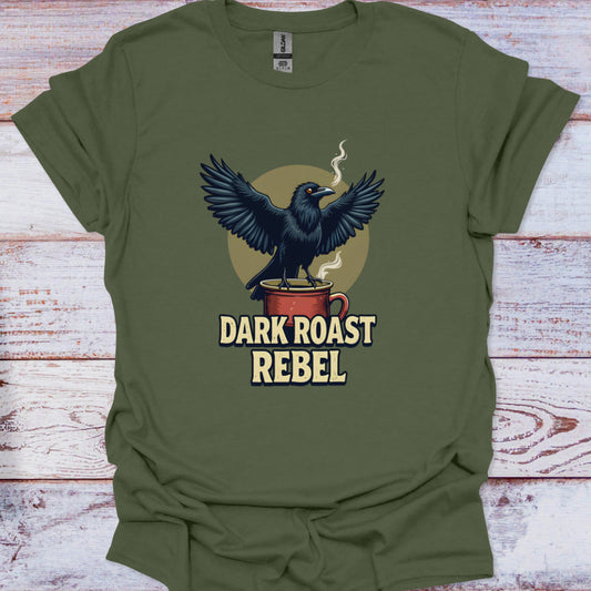 Green t-shirt with a crow on a coffee cup graphic and 'Dark Roast Rebel' text on a wooden surface.