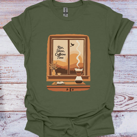 Green t-shirt with a window graphic and 'Rise, Shine, Caffeine Time' text on a wooden surface.