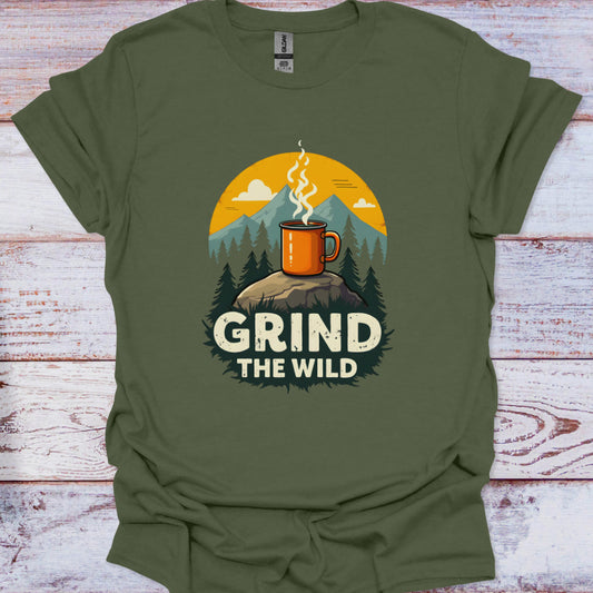 Green t-shirt with a graphic of a mug on a rock with trees and mountains, and 'Grind the Wild' text.