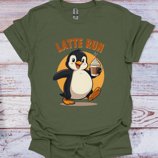 Green t-shirt with a penguin holding a cup of coffee and 'Latte Run' text on a wooden surface