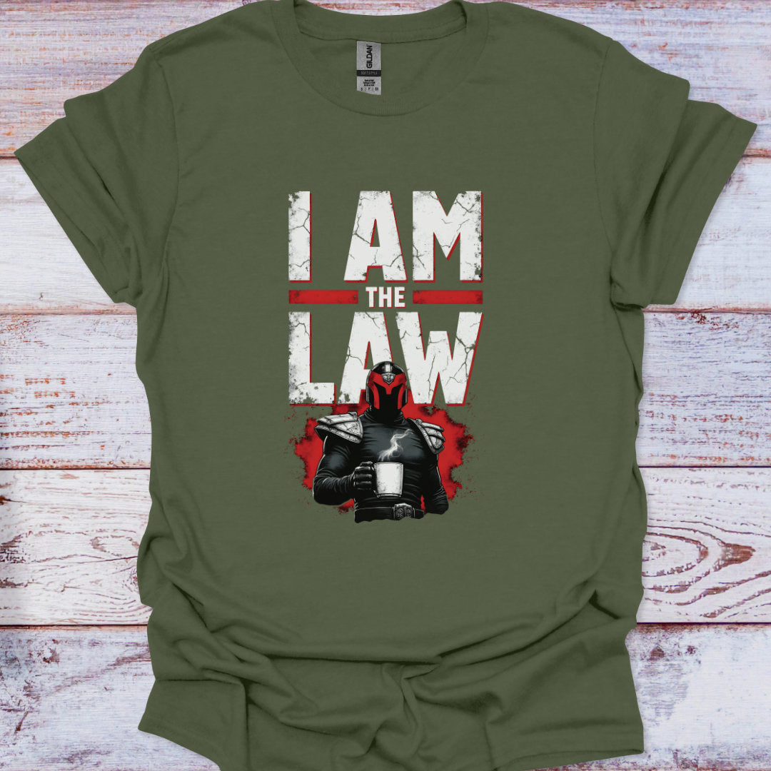 Green t-shirt with 'I AM THE LAW' graphic on a wooden surface