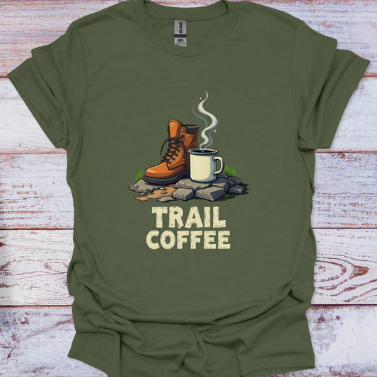 Green t-shirt with 'Trail Coffee' graphic featuring hiking boots and a mug on a wooden surface