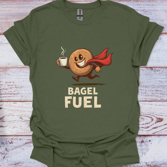 Green t-shirt with a bagel character holding a coffee cup and 'Bagel Fuel' text on a wooden surface