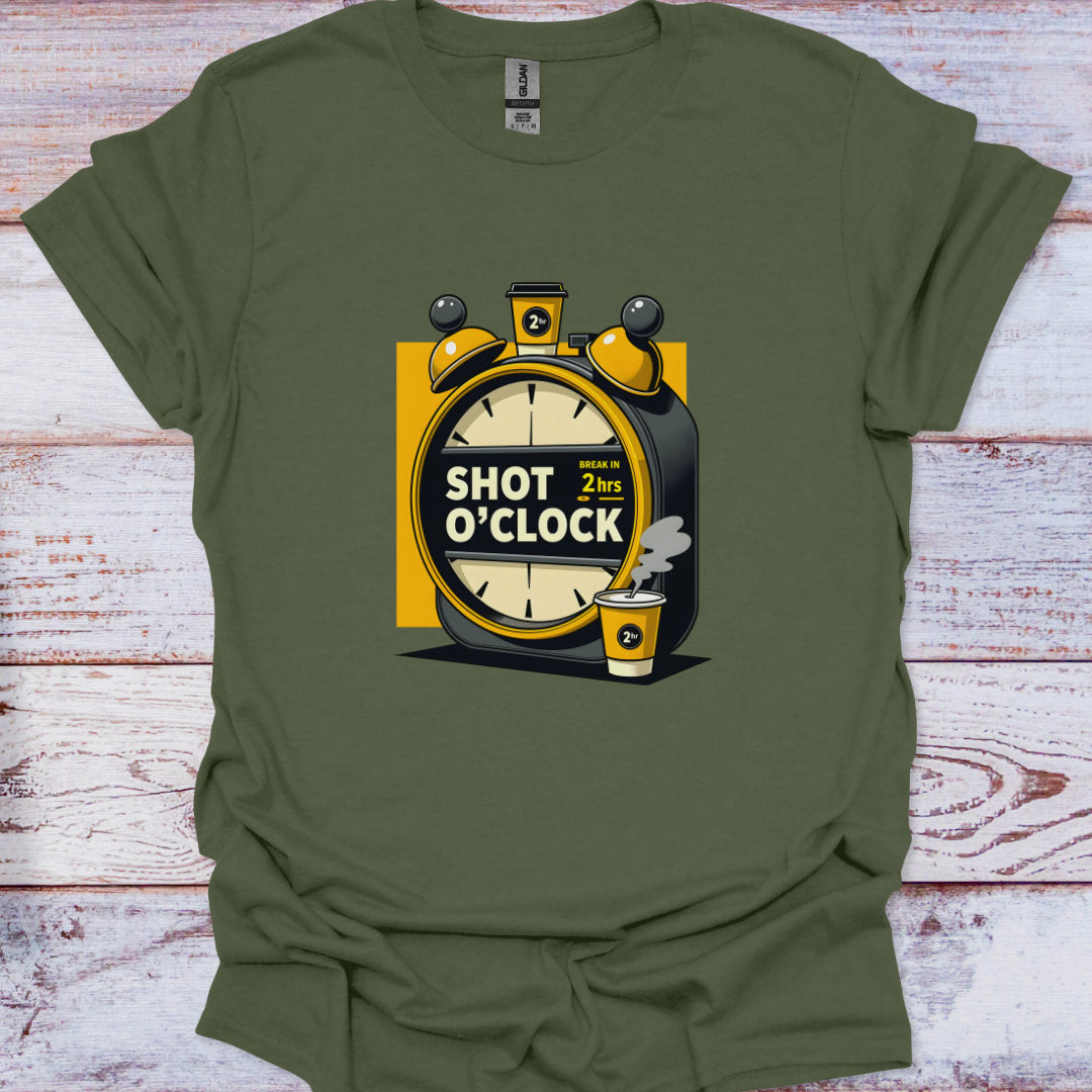 Green t-shirt with a graphic design of an alarm clock and coffee cup on a wooden surface